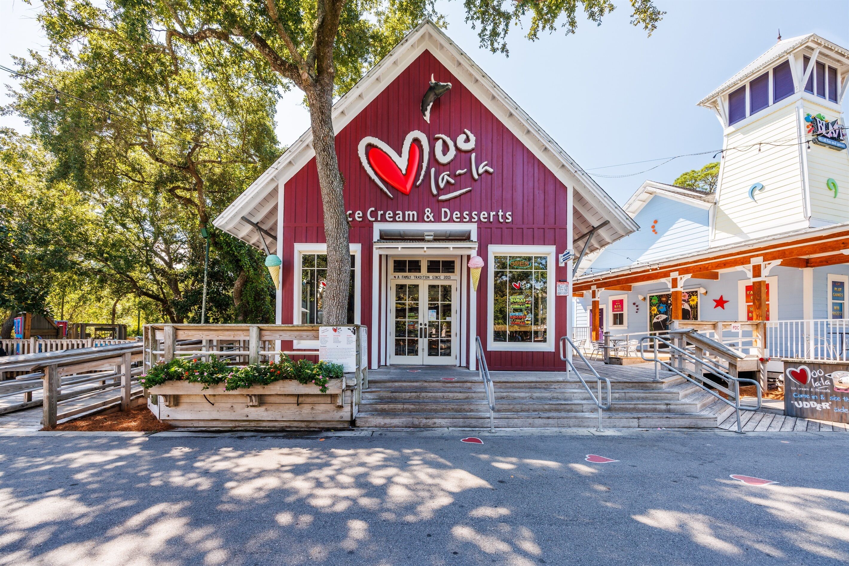 A red building with a heart-shaped sign and the words 'Ice Cream & Desserts' on the front.