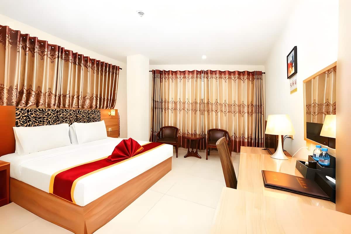 Habitación Business individual | Ropa de cama de alta calidad y colchones con acolchado adicional