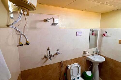 Shower, slippers, towels, soap