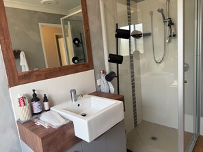 Shower, hair dryer, towels, soap