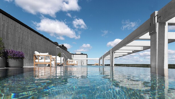 A swimming pool with clear water, wooden deck chairs, and a modern building with a grey facade. - Nemunas Aparthotel (Druskininkai)