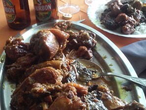 A meal with meat and rice on a table. - Creole B&B in Les Avirons, perfect for hiking (Les Avirons)