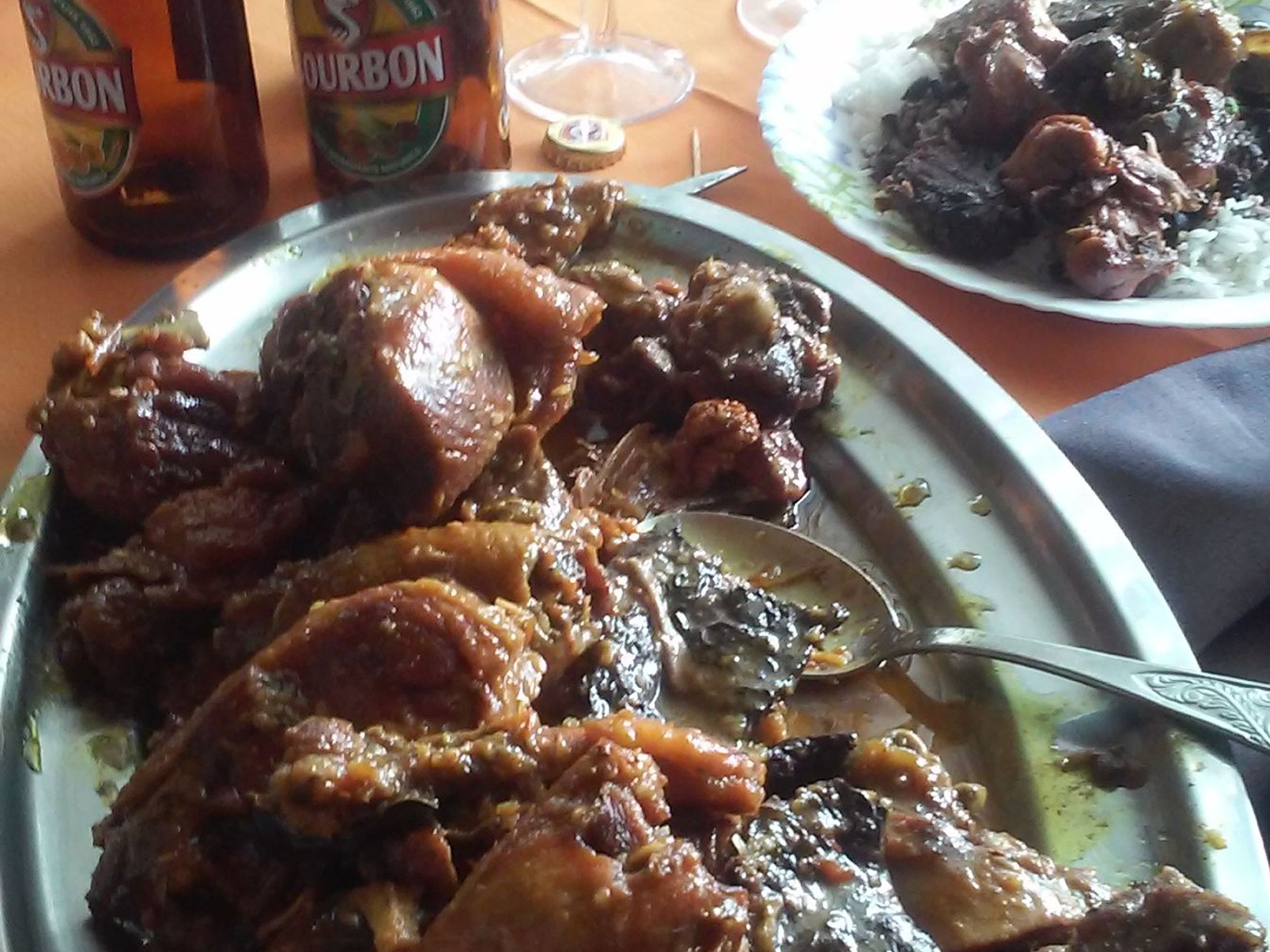 A meal with meat and rice on a table.
