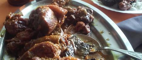 A meal with meat and rice on a table.