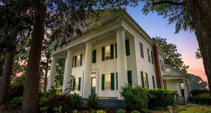 A historic, opulent retreat surrounded by sprawling lawns and peaceful countryside beauty.
