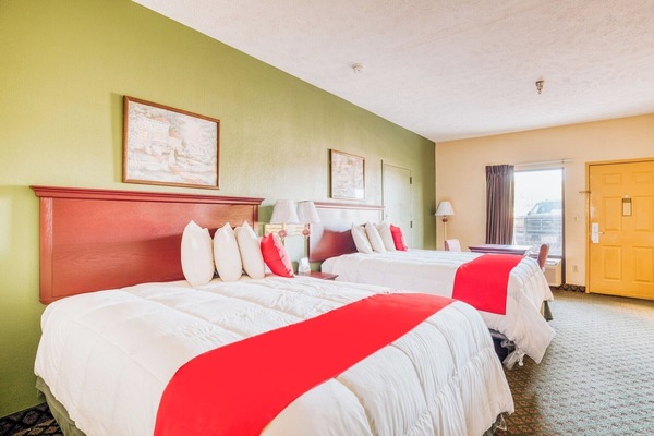 Unwind in crisp linens across two cozy queen beds.