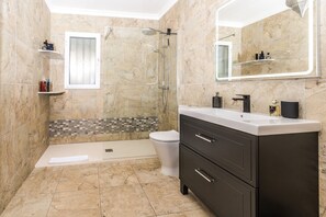 Shower, hair dryer, towels, toilet paper