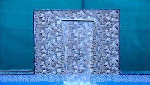 A pool with a stone waterfall feature. - Pawna Ns4 villa (Mawal)