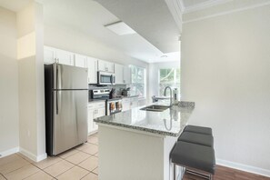 Fridge, dining tables - Landing | Chic 1BD, Gym, Pool (Orlando)