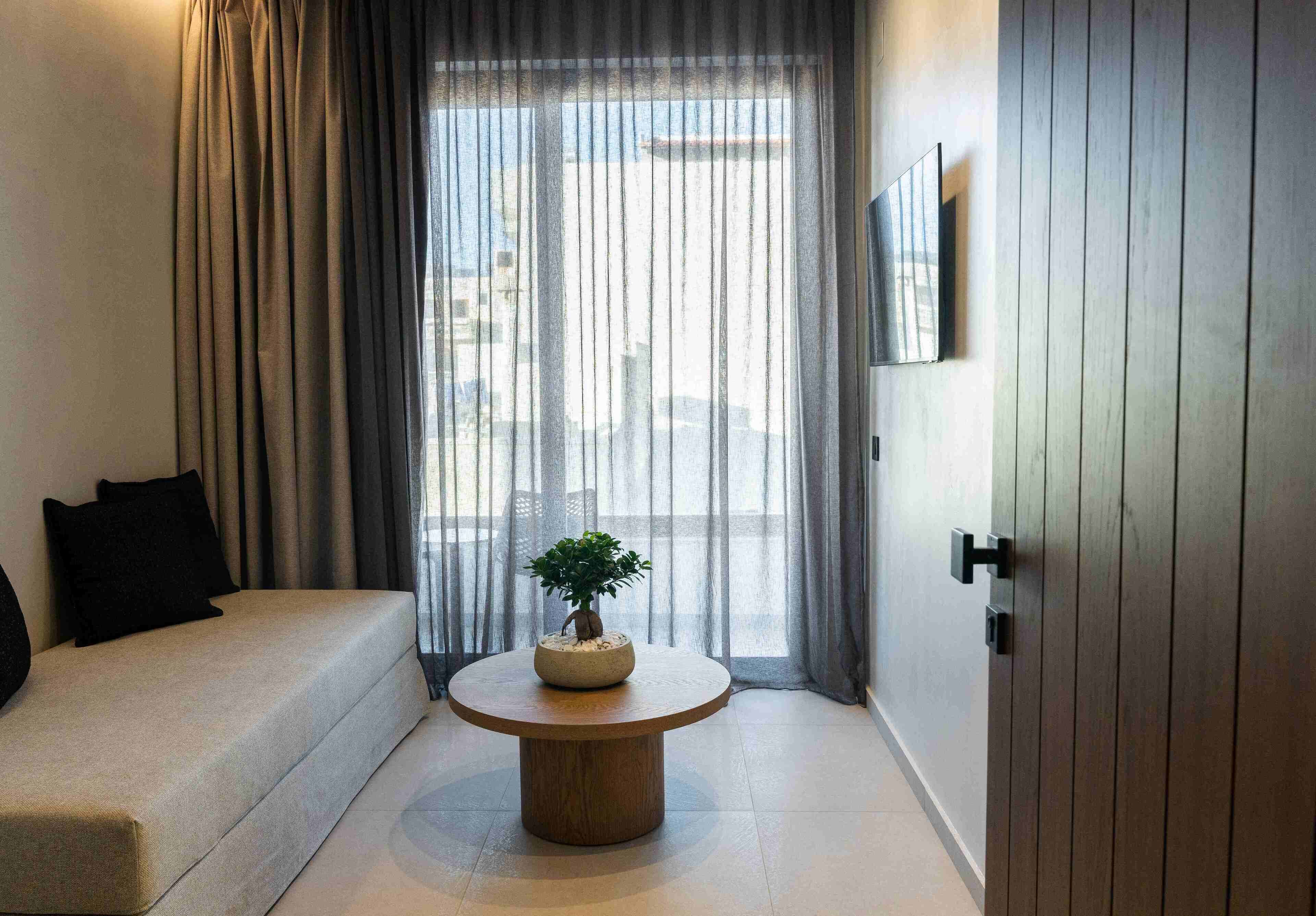 Suite junior, vistas a la ciudad | Zona de estar