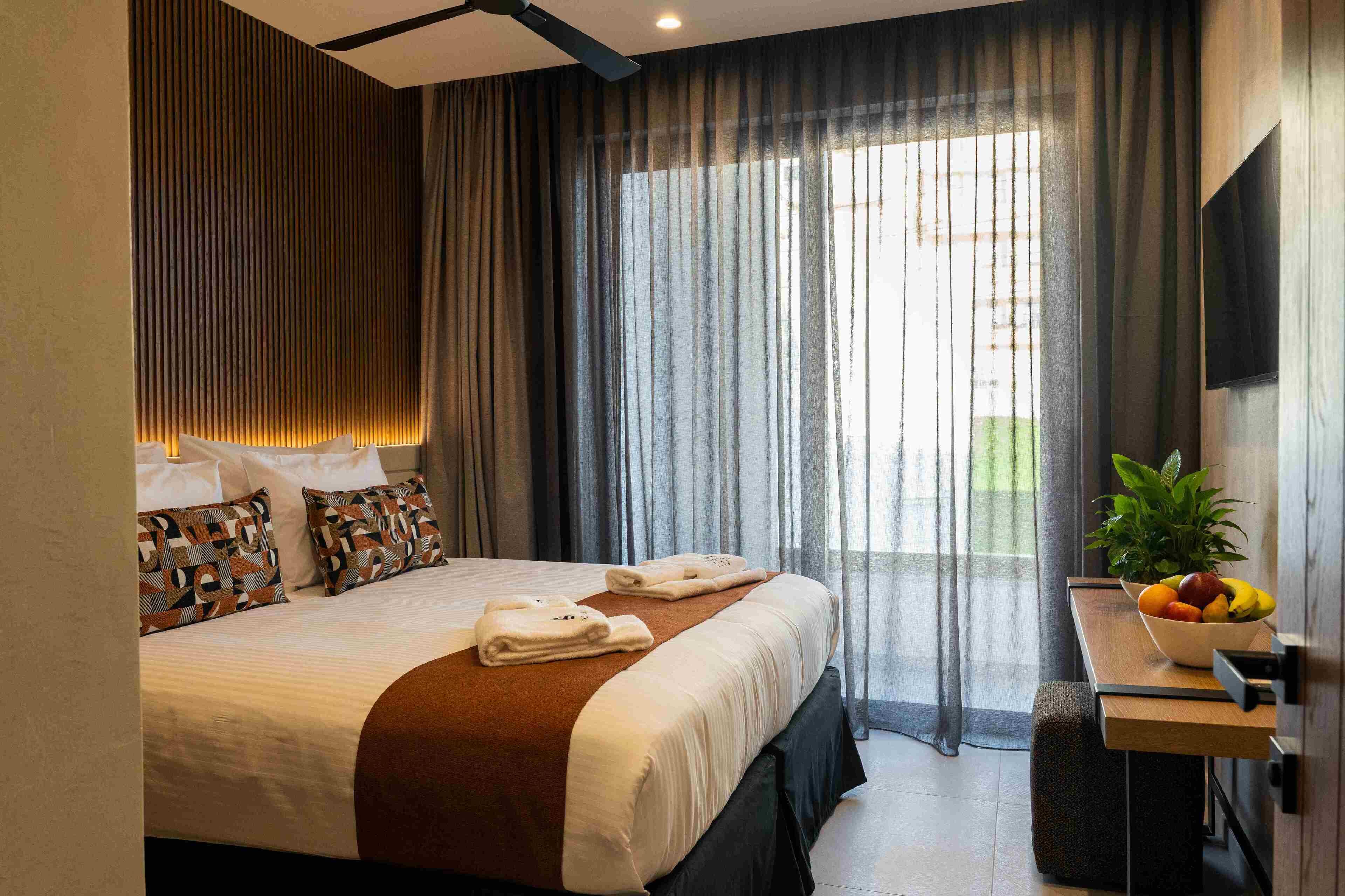 Junior Suite, City View | In-room safe, desk, laptop workspace, blackout curtains