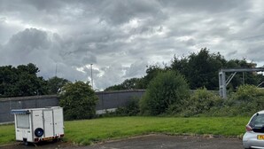 A parking lot with a trailer and a car. - Cosy room for Female Couple and Families (Manchester)