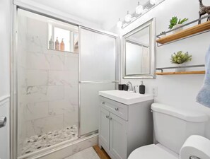 Shower, hair dryer, towels, soap