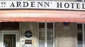 The exterior of the Ardenn' Hotel with a signboard, a door, and a window. - ARDENN HOTEL (Reims)