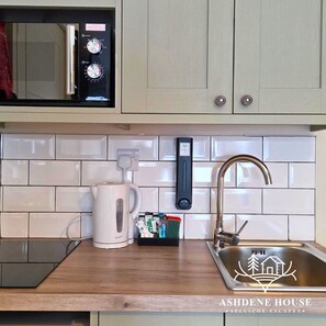 Fridge, microwave, stovetop, cookware/dishes/utensils