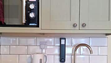Fridge, microwave, stovetop, cookware/dishes/utensils