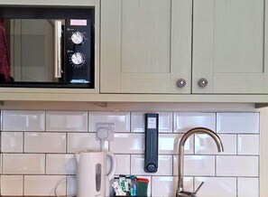 Fridge, microwave, stovetop, cookware/dishes/utensils