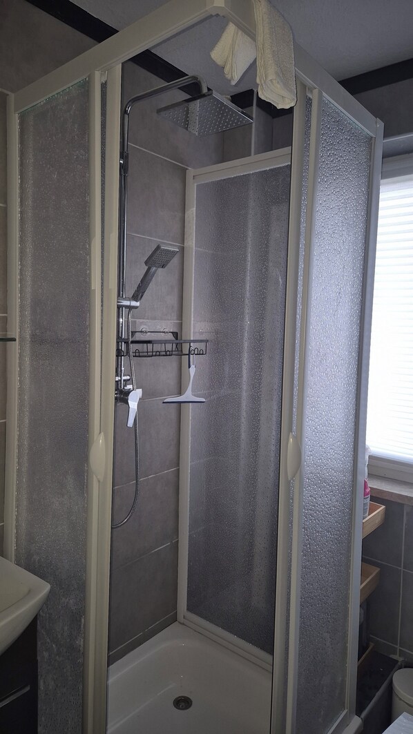Shower, hair dryer, towels, soap