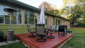 A deck with outdoor furniture and a grill area. - A2 Oasis; Lovely Neighborhood; Walk to Stadium and Crisler Arena! (Ann Arbor)
