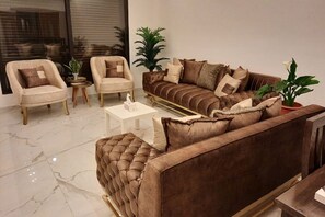 TV, fireplace - Modern Apartment in the Heart of Amman (Amman)