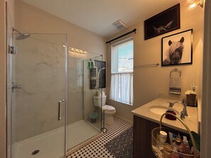 Shower, hair dryer, towels, soap