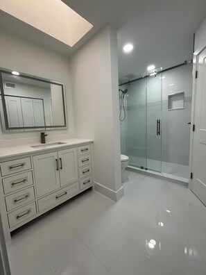 Shower, towels, soap, toilet paper