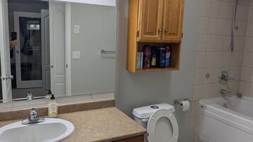 Jetted bath, hair dryer, towels, soap