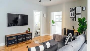 Classic Apartment, 1 Queen Bed | Living area | 55-inch TV with digital channels, streaming services