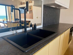Oven, stovetop - Colibrí; Beach front ground floor apartment with ocean views, luxury kitchen (Bahía de Kino)