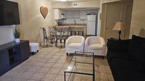 A compact living space with a kitchen, dining area, and seating. - NEW LOW RATE FOR THE SUMMER!                3-bed 2-bath townhome in Tempe (Tempe)