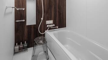 Combined shower/tub, free toiletries, hair dryer, slippers