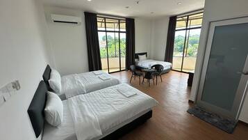 Deluxe Family Room with Balcony | Iron/ironing board, free WiFi, bed sheets