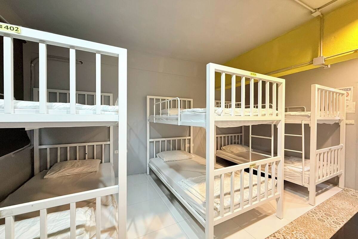 A room with bunk beds, each labeled with a number.