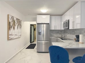 Fridge, microwave, stovetop, coffee/tea maker