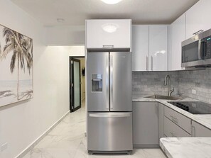 Fridge, microwave, stovetop, coffee/tea maker