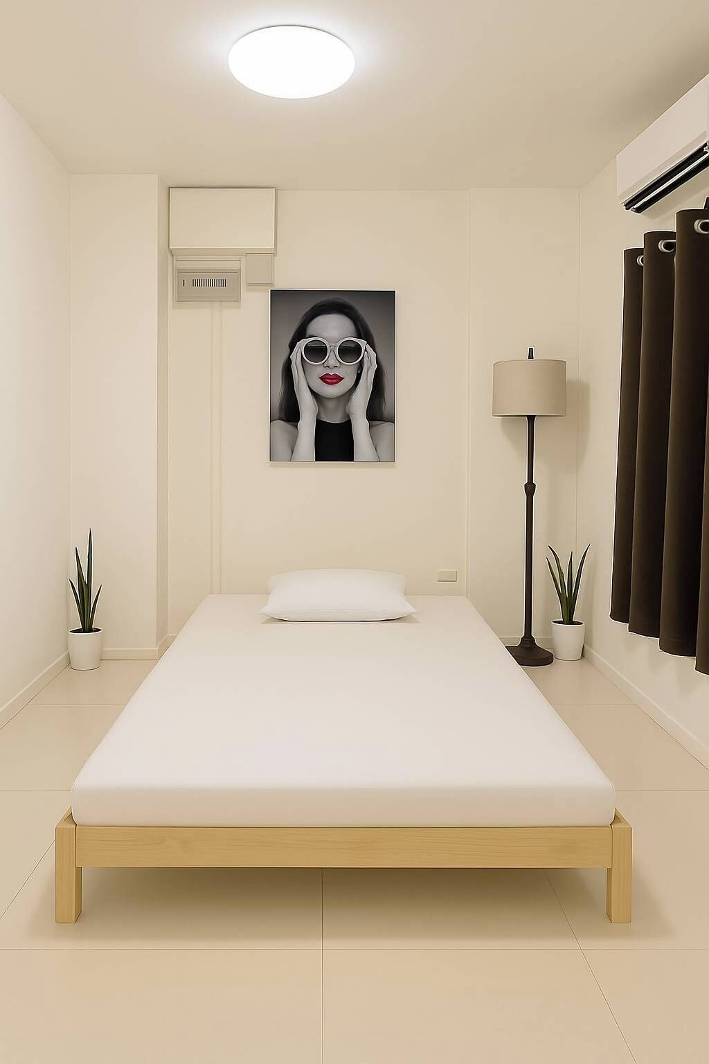 A minimalist bedroom with a single bed, a wall-mounted air vent, a floor lamp, and two potted plants.
