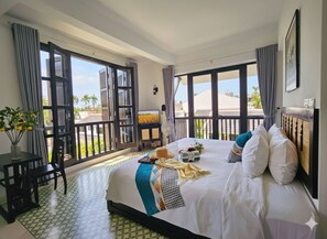 Elite Double Room, Balcony, Courtyard View | In-room safe, desk, blackout drapes, soundproofing - Nghé Garden Resort Hoian (Hoian)
