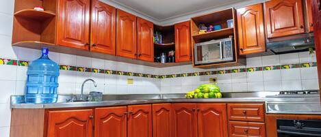 Microwave, oven, blender, cookware/dishes/utensils