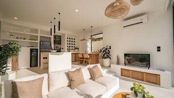 Deluxe Villa, 1 King Bed, Pool View | Living room | 43-inch TV with cable channels