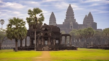 A temple complex with a central structure and two large towers.