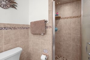 Shower, hair dryer, towels, toilet paper