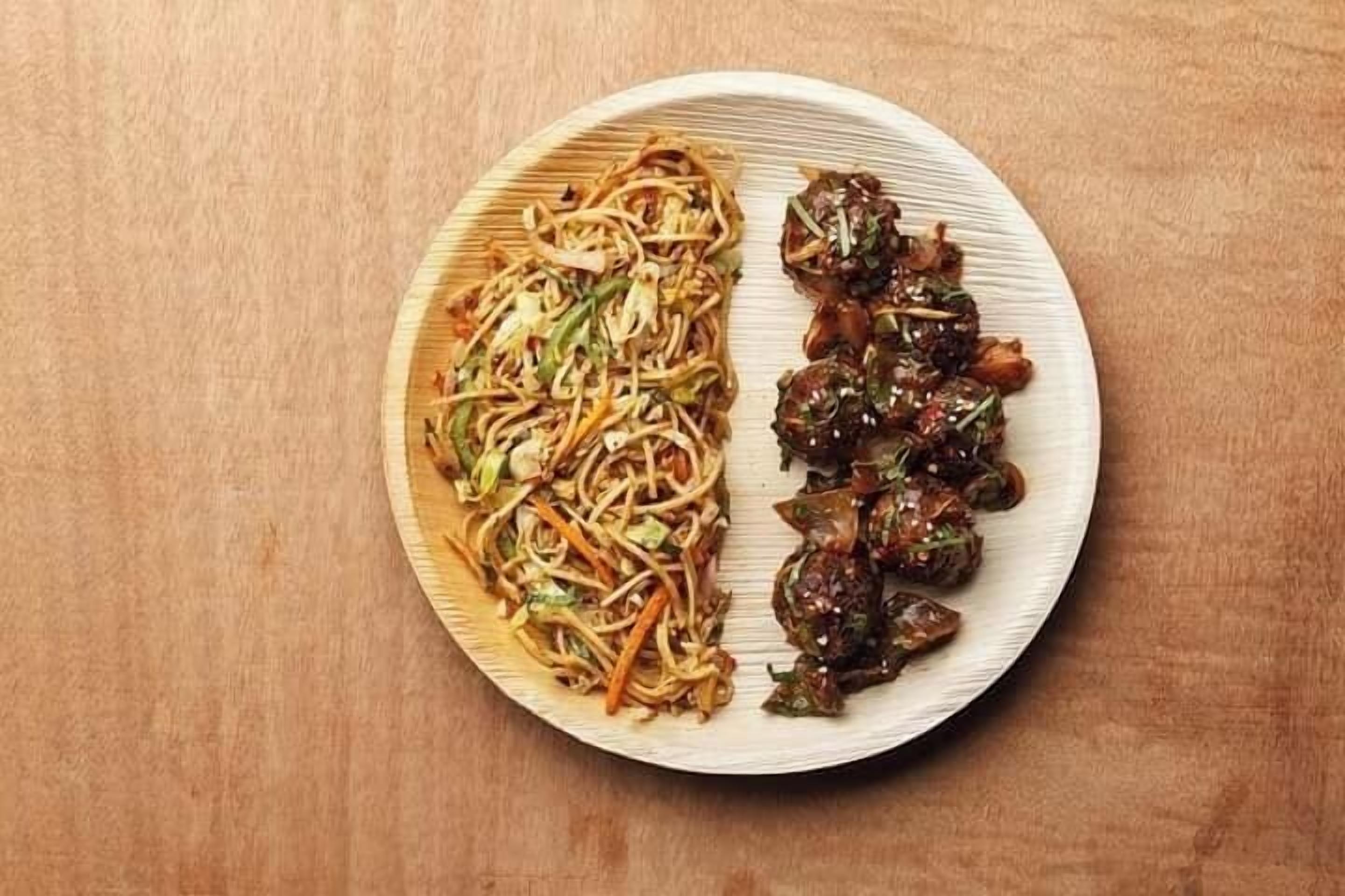 A plate with noodles and stir-fried vegetables.