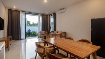 Family Villa, Patio, Pool View | Living area | TV