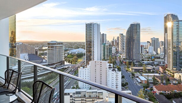 A high-rise building with a cityscape view from a balcony. - Ocean View 3-bed With Gym, Pool (Gold Coast)