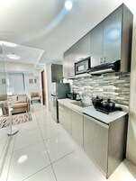Deluxe Condo, Balcony, City View | Private kitchenette | Fridge, electric kettle