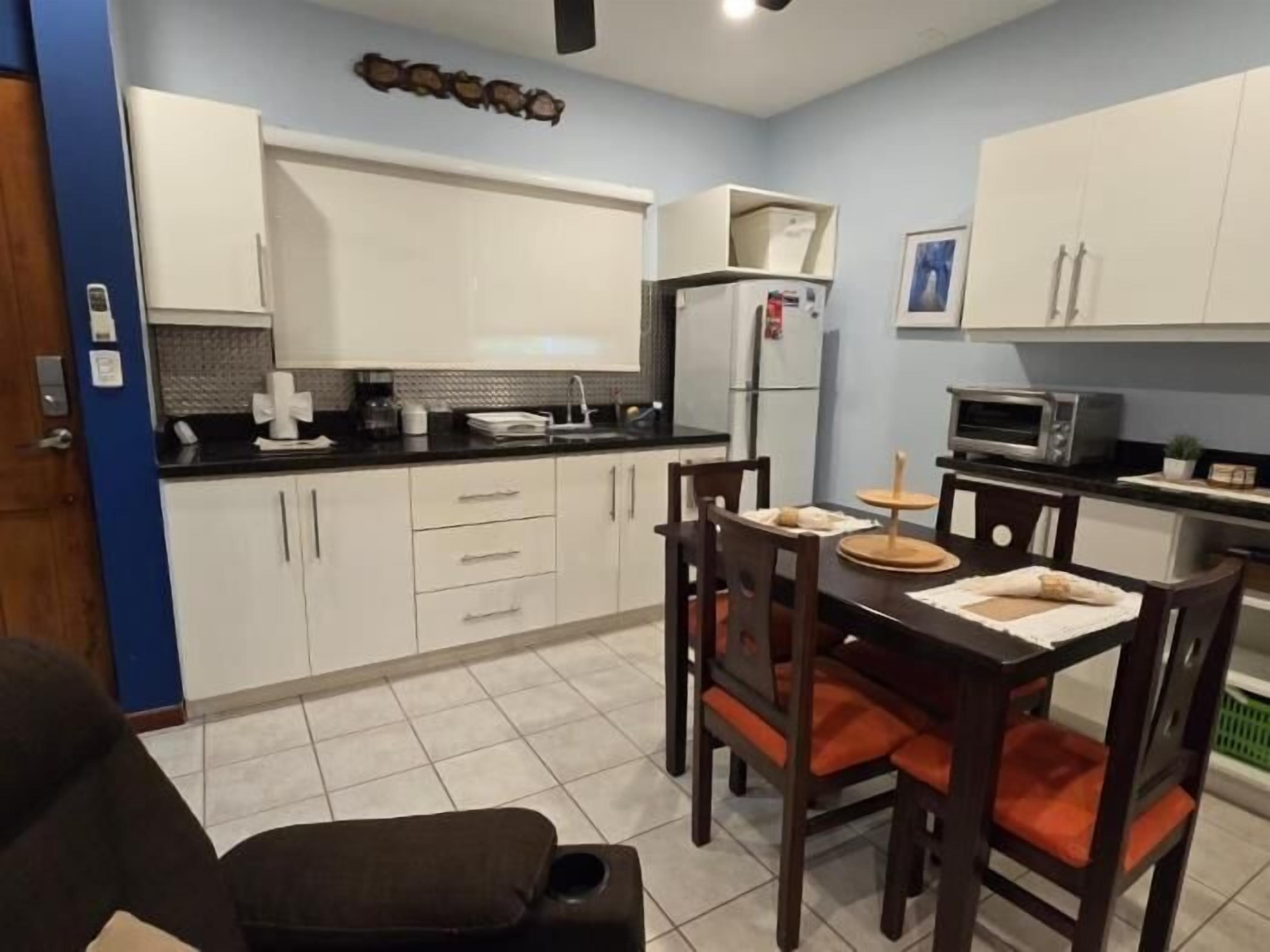 Fridge, microwave, cookware/dishes/utensils