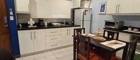 Fridge, microwave, cookware/dishes/utensils