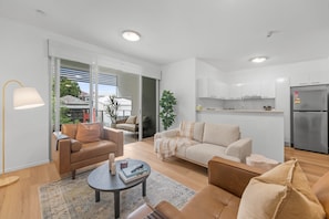 Apartment | Living room - 2-bed Getaway With Shared Pool & BBQ Access (Brisbane)