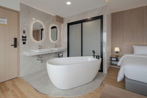 Superior Studio Suite, 1 King Bed, Non Smoking, City View | Bathroom | Separate tub and shower, hair dryer, towels, soap - Solyn Hotel (Bangkok)