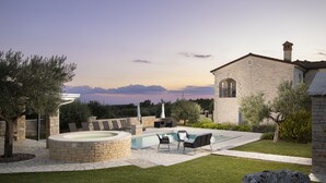 A stone building with a pool and outdoor seating. - Villa Piccolo Paradiso with Heated Pool, Jacuzzi & Sauna (Rovinjsko Selo)